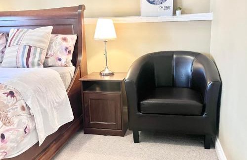 Southwest Calgary House | Cozy Walkout suite with King bed, Kitchen, Parking & Patio