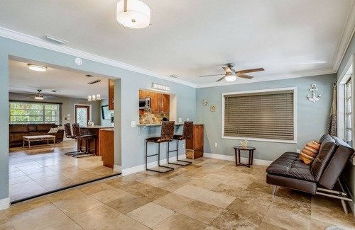 Fort Myers House | Creekside retreat with screened pool, patio, grill, firepit, canoe + kayak, & AC