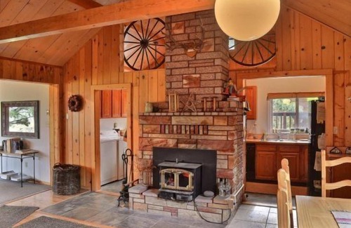 Wapiti Cabin | Creekworks Cabin- Wapiti Valley, surrounded by trees with creek access