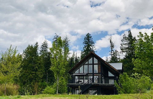 Slocan Ski Chalet | Custom chalet-style home perched on a mountain terrace