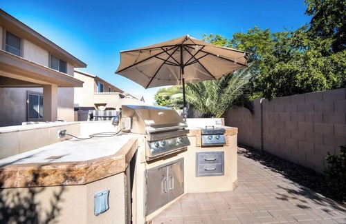 Roosevelt Park House | Custom home with 5 Beds & 5.5 Baths! A heated pool & spa make the backyard feel like a resort