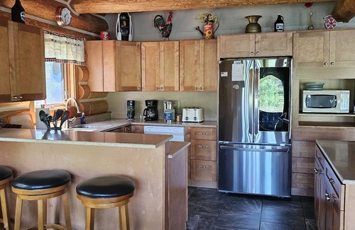 Columbia Falls Cabin | Custom Log Home bordering Glacier Park and North Fork River!