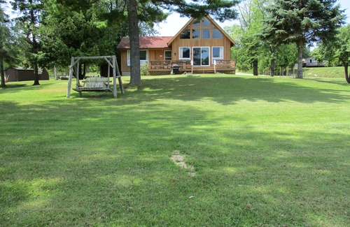 Drummond House | Dad's Paradise on Pigeon Cove offers WaterFront Sunrise Views and Lake Access!
