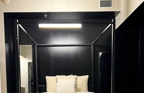 Downtown Winnipeg Apartment | Dark themed minimalist apart at the heart of downtown Winnipeg .