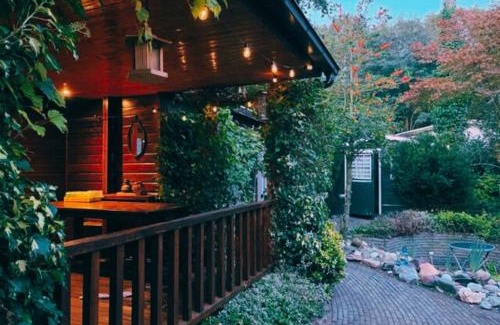 Hattemerbroek Ski Chalet | "De Jungle" Chalet met veranda op IJsselheide Hattemerbroek Veluwe