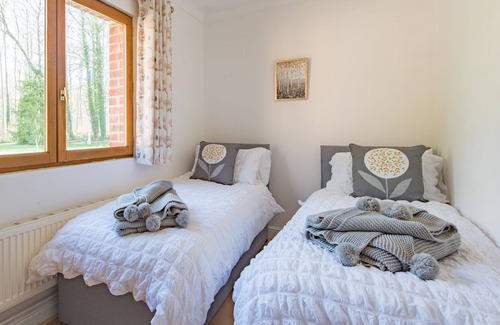 Doddington House | Delightful lodge located in the middle of Sharsted Wood near Canterbury with a pool!