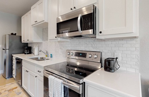 Kyle House | Delightful & modern duplex w/ patio, AC, & W/D - located near campus & shopping