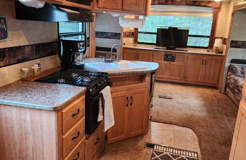 Nevis RV Rental | Deluxe Camper at a RV park