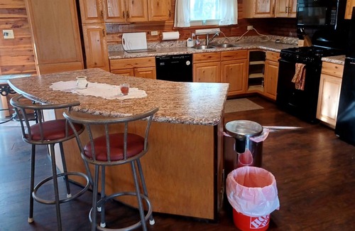 Fittstown House | Deluxe log home with 57 acres on 1/2 mile of the SO. Canadian river. Sleeps 6.
