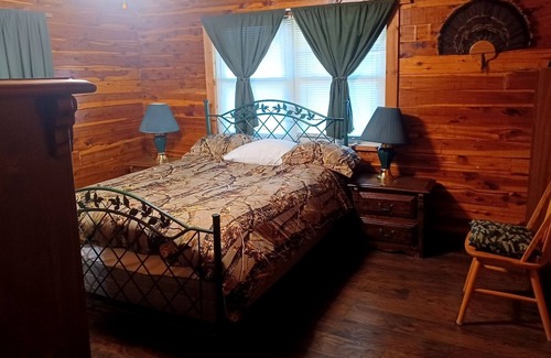 Fittstown House | Deluxe log home with 57 acres on 1/2 mile of the SO. Canadian river. Sleeps 6.