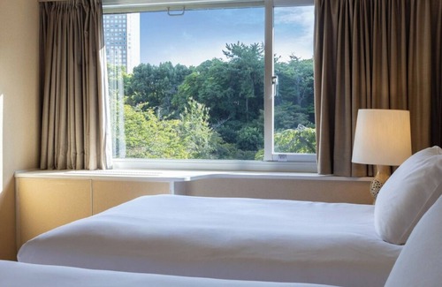Takanawa Hotel | Deluxe Triple Room hotel with AC, fitness room, WiFi in amazing Minato City