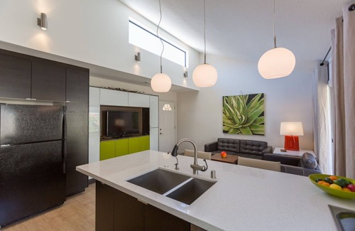 Uptown Design District Condo | Designer Condo With Wrap Around Patio Located in the Famous Movie Colony