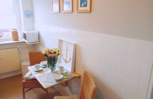 Busumer Deichhausen Apartment | Directly on the North Sea (200 m). Free beach chair on the dike (May - Sept.).