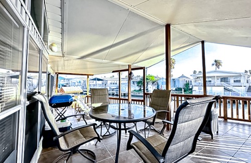 Port Isabel House | Dog-friendly bayfront home with in/outdoor pools, tennis, gym, W/D, bay views