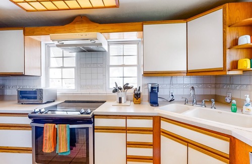 Lower Matecumbe Beach House | Dog-friendly escape with private dock, porch, balcony, water view, & central AC
