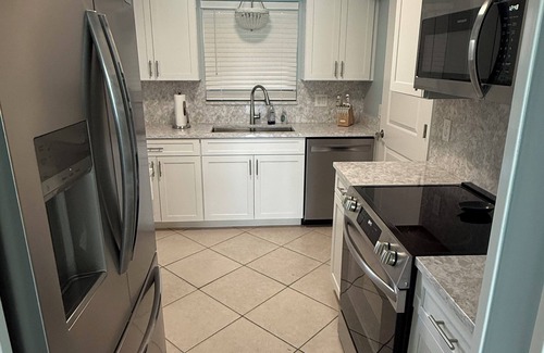 Treasure Island Condo | Dolphin & Manatee At Your Back Door!