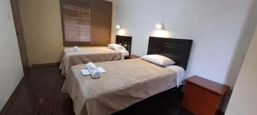 La Perla House | Dormitorio con baño compartido a 25 minutos del Apto