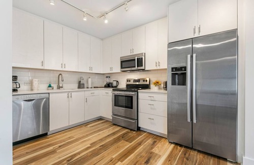 Central Business District Hotel | Downtown Delight: 4BR/2BA Luxury Condo