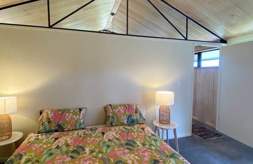 Topaz Other | Early Diggings Hut surrounded by Rainforest and verdant pasture.