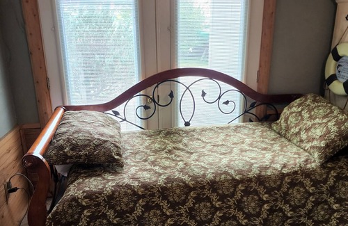 Alpena Cottage | Edge of Brothers Bay on Long Lake, Alpena, MI. Weekday 3 People base rate