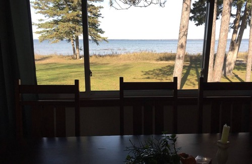 Cheboygan House | Elegant beachfront home with BOAT SLIP/Club amenities within walking distance.
