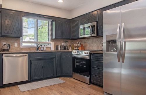 West Omaha House | Elegant Golden Getaway, w/Hot Tub & Fenced Yard!