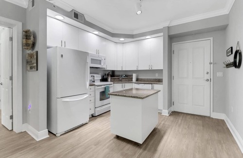 Fort Myers Condo | Elegant, Upscale Waterfront Condo! Unforgettable Sunsets! Stunning Pool & Pool Deck! Free Parking