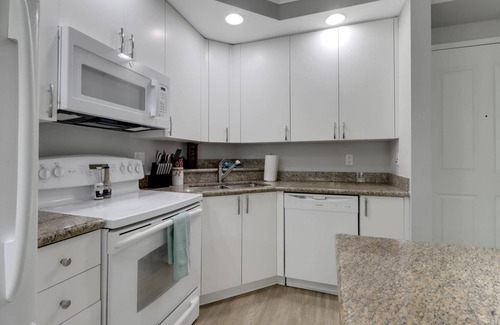 Fort Myers Condo | Elegant, Upscale Waterfront Condo! Unforgettable Sunsets! Stunning Pool & Pool Deck! Free Parking
