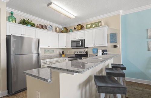 West Panama City Beach Condo | Emerald Isle 1401 - Front row beach chair service included! Affordable rates!