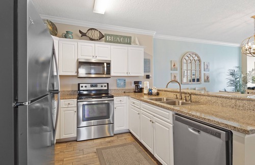West Panama City Beach Condo | Emerald Isle 1401 - Front row beach chair service included! Affordable rates!
