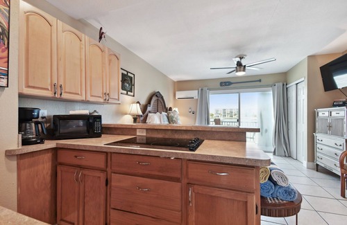 Bay Esplanade Apartment | Enchanted Inn Suite #6 w/View of the Intra-costal water-way Pool, Fishing Dock,