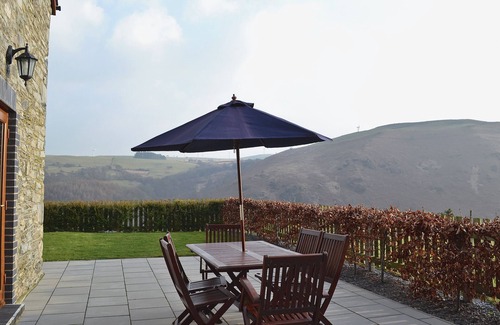 Glandyfi Cottage | Enjoy a holiday here at any time of year in this cosy converted cottage.