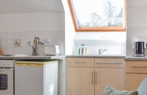 Killin Cottage | Enjoy a relaxing stay at Pine Cottage, a first floor apartment where you can participate in a game o