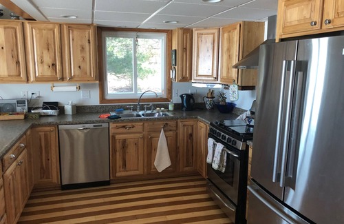 Burt Lake Ski Chalet | Enjoy all four seasons at the Swiss Chalet located on the shore of Burt Lake.