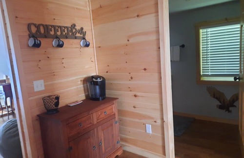 Smithfield Cabin | Enjoy amazing sunsets while steps from North Pond in this cozy 3-bedroom camp.