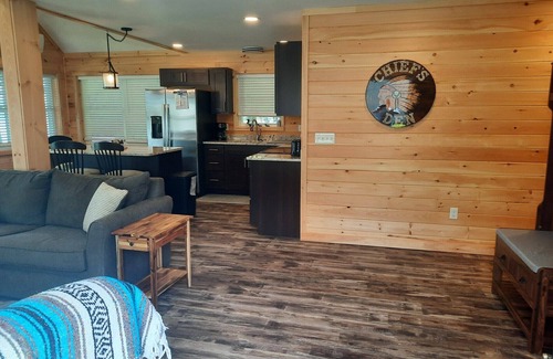 Smithfield Cabin | Enjoy amazing sunsets while steps from North Pond in this cozy 3-bedroom camp.