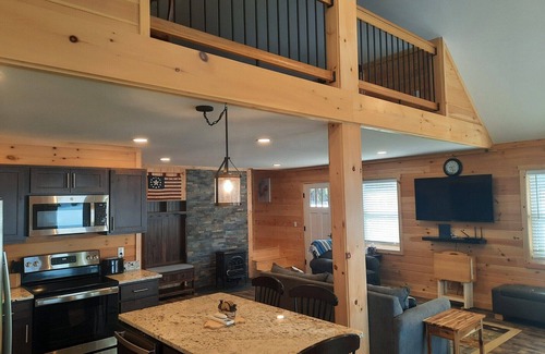 Smithfield Cabin | Enjoy amazing sunsets while steps from North Pond in this cozy 3-bedroom camp.