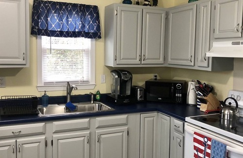 Colington Cottage | Enjoy the Cool Breeze! Fireplace, 2 Decks! Soundside, Dogs OK, Bay Dr, Hammock