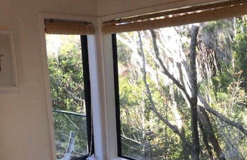 Opua Cabin | Escape to this romantic cabin in amongst the trees.
