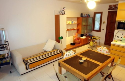 Lignano Pineta Villa | Excellently equipped row house with fenced garden for 8 in Lignano Pineta
