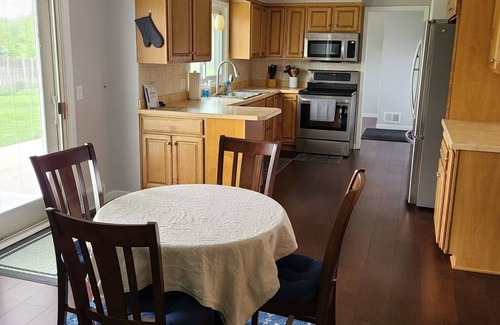West Omaha House | Executive Rental - 4 bed, 4 bath fully furnished home W/L2 EV Charging Station