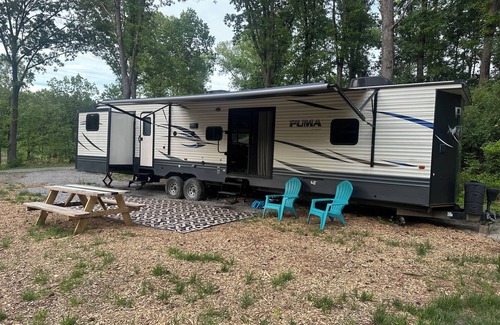 Carterville RV Rental | Experience Glamping in style. Private Lake - Pet Friendly!
