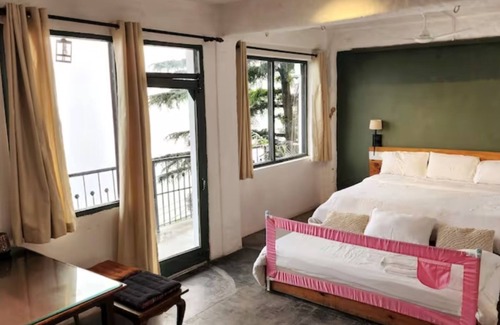 Dharamshala Bed & Breakfast | Experience the beauty of nature at Bímil/East. Relax in our cozy bed & breakfast