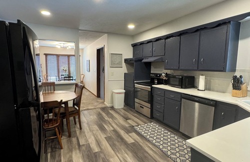 Wichita House | Experience Wichita living near WSU! Fire Pit, Pool Table, and Arcade games.