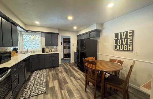 Wichita House | Experience Wichita living near WSU! Fire Pit, Pool Table, and Arcade games.