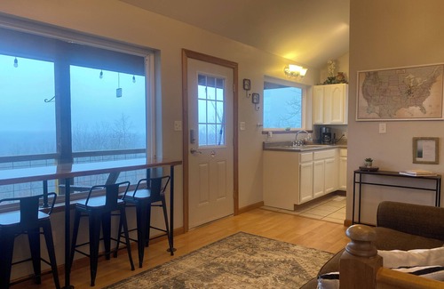 Cobden Cabin | Exquisite views of Shawnee National Forest seen from a private, covered hot tub.