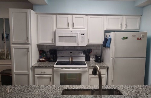 Sunset Beach Condo | Extra large first floor condo with indoor & outdoor pools, close to the beach.