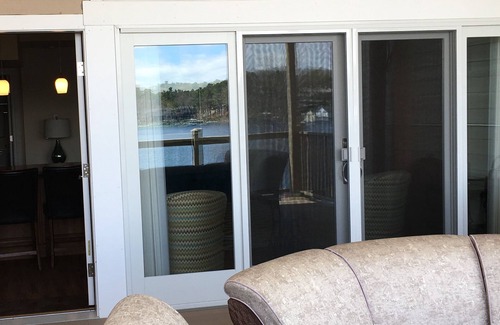 Charlevoix Condo | Fabulous view of Round Lake and Marina from covered deck
