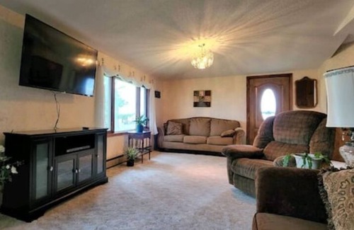 Faribault County House | Family cottage nestled along the woods & river