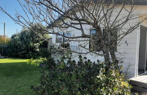 Waitarere Beach House | Family friendly, fully fenced bach, close to the beach, shops and playground.